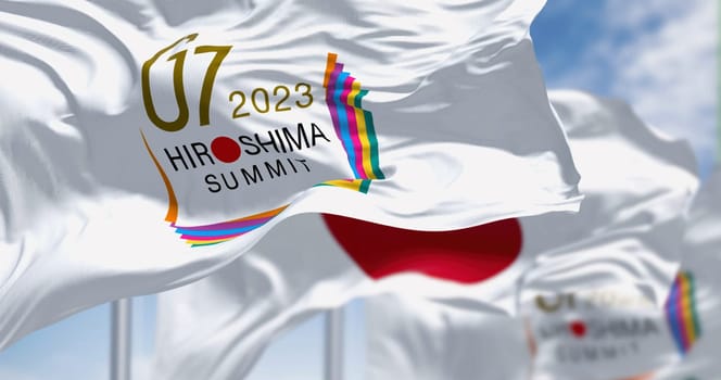 Hiroshima, JP, March 2023: flags of G7 Hiroshima 2023 and the national flag of Japan waving. The G7 2023 summit will take place from May 19 to May 23. Illustrative editorial 3D illustration render