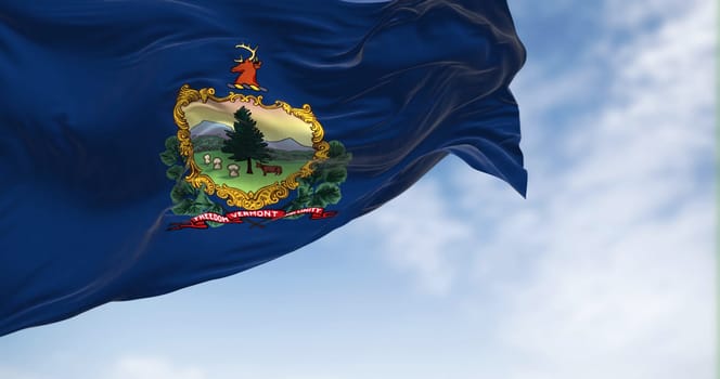 The Vermont state flag fluttering in the wind on a clear day. Coat of arms and motto Freedom and Unity on a blue background. 3D illustration render. Rippled textile. American Federate state