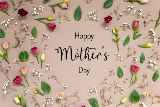 Flower Arrangement With English Text Happy Mothers Day. Colorful Spring Blossoms And Flowers Like Roses Building A Frame. Flat Lay With Brown Paper Background