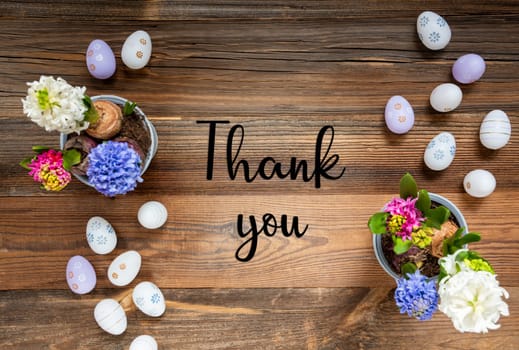 Easter Flat Lay With English Text Thank You. Flowers With Easter Egg Decoration And Ornament. Hyacinth Flower Arrangement With Wooden, Vintage Background.