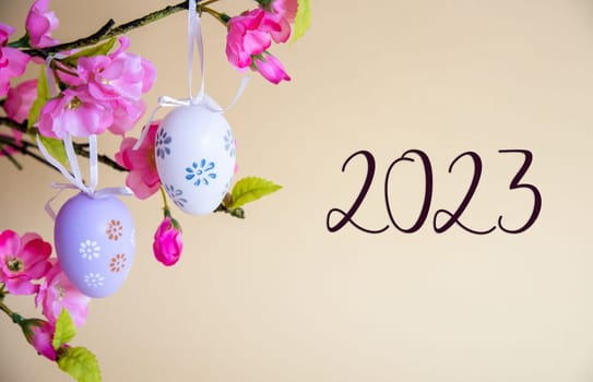Beautiful Easter Egg Decoration With Spring Flowers. English Text 2023. Seasonal Easter Holiday Greeting Card.