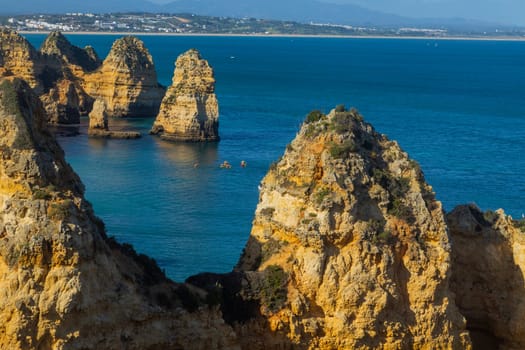 Ponta da Piedade cliffs near Lagos, Portugal. Beautiful seascape with natural rock formations in the Algarve, Portugal