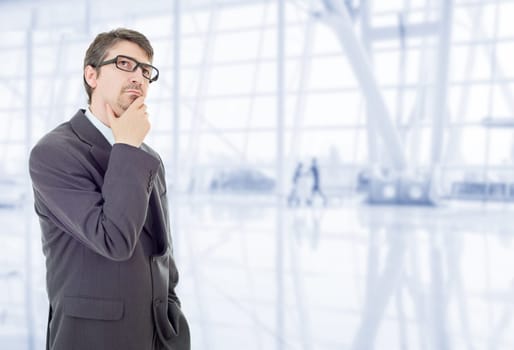 young business man thinking, at the office