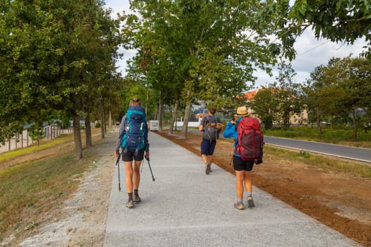 Navarre, Spain, 26 August, 2022: Pilgrims walk along the Camino De Santiago, the Way of St. James pilgrimage route, Navarra, Spain.