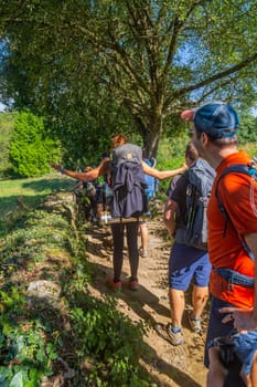 Navarre, Spain, 26 August, 2022: Pilgrims walk along the Camino De Santiago, the Way of St. James pilgrimage route, Navarra, Spain.