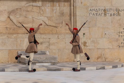ATHENS, GREECE - MAY 06 2022: Presidential ceremonial guards - Evzones at the Tomb of the Unknown Soldier in front of the Greek Parliament, Athens, Greece