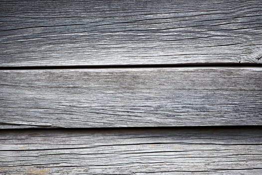 Wooden boards that lie next to each other. A wood texture made of several wooden boards.