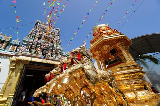 George Town, Penang, Malaysia - Jan 16 2022: Golden chariot and the background of Sri Mahamariamman Temple