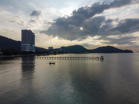 Teluk Kumbar, Penang, Malaysia - Mar 11 2022: Lexis Suites Hotel with wooden bridge during morning sun