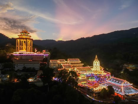 Ayer Itam, Penang, Malaysia - Feb 19 2022: Dramatic sunset over Kek Lok Si temple with illuminated led light