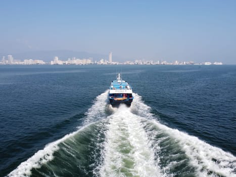 Butterworth, Penang, Malaysia - Mar 12 2022: Passenger ferry move at sea with wave at back
