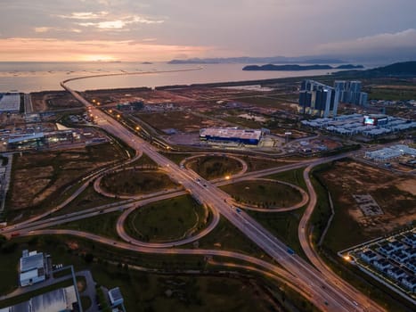 Batu kawan, Penang, Malaysia - Mar 14 2022: Aerial view highway interchange at Batu Kawan with background of Penang Second Bridge