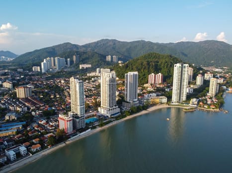 Tanjung Tokong, Penang, Malaysia - Mar 27 2022: Aerial view tall condominium at sea coastal during sunny day