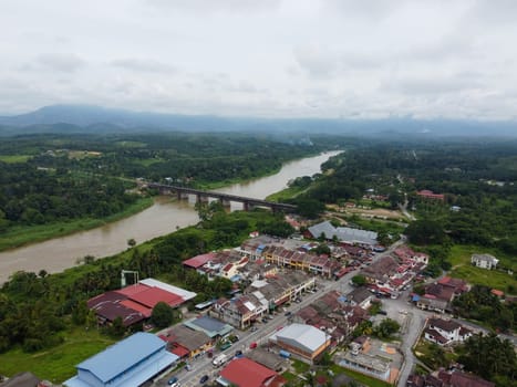 Kuala Kangsar, Perak, Malaysia - May 04 2022: Aerial view Kuala Kangsar Victoria railway Bridge and town