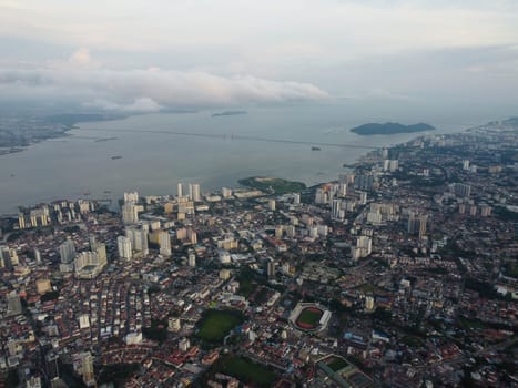 George Town, Penang, Malaysia - Jun 07 2022: Aerial view Penang residential building with background of Penang Bridge