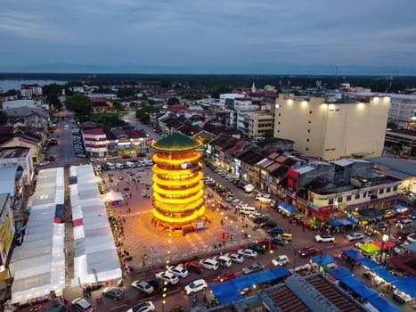 Teluk Intan, Perak, Malaysia - May 01 2022: Teluk Intan tower with beauty illuminated led light and town in blue hour