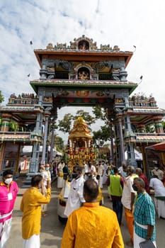 George Town, Penang, Malaysia - Jan 17 2022: Vertical view of gold chariot arrive archway during Thaipusam
