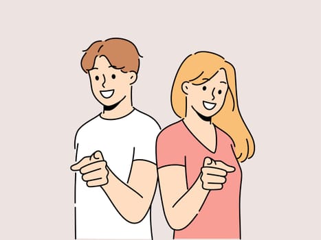 Smiling people point at screen