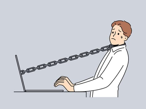 Stressed male employee tied with chain to computer in office. Unhappy man worker attached to laptop struggle with stressful job. Vector illustration.