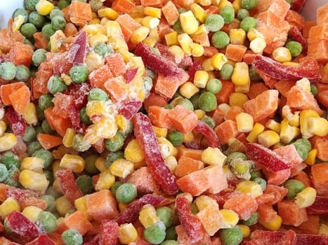 Mexican vegetable mixture. Pieces of pepper, carrots, corn and green peas. A colorful mix of the freshest and hottest vegetables.