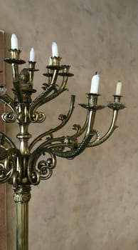 antique bronze candelabra with extinguished candles