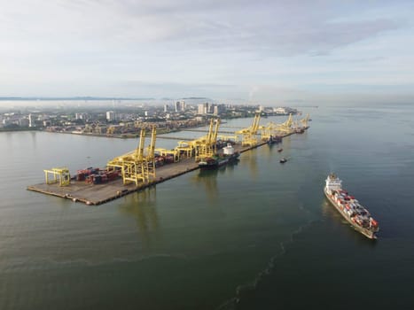 George Town, Penang, Malaysia - Jun 12 2022: Aerial view container ship and terminal port Butterworth