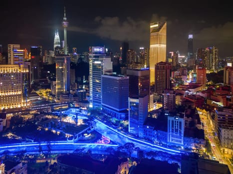 Bukit Bintang, Kuala Lumpur, Malaysia - Dec 03 2022: Aerial view River of Life and MasjidJamek with background of skyline in night
