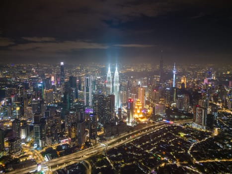 Bukit Bintang, Kuala Lumpur, Malaysia - Dec 04 2022: Aerial view Kampubng Baru and KL city in night