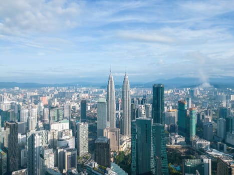 Bukit Bintang, Kuala Lumpur, Malaysia - Nov 30 2022: Aerial view of Kuala Lumpur KLCC Tower in the day reveals a city