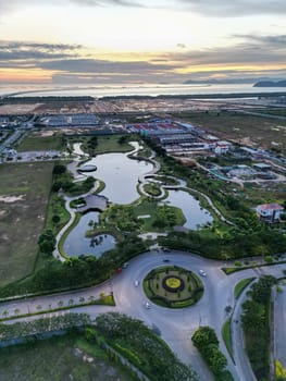 Batu Kawan, Penang, Malaysia - Sep 22 2022: Aerial vertical view Batu Kawan Cental Park in evening sunset