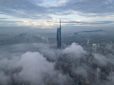 Bukit Bintang, Kuala Lumpur, Malaysia - Nov 13 2022: The aerial view of Merdeka 118 during morning low cloud provides a unique perspective of Kuala Lumpur's skyline.