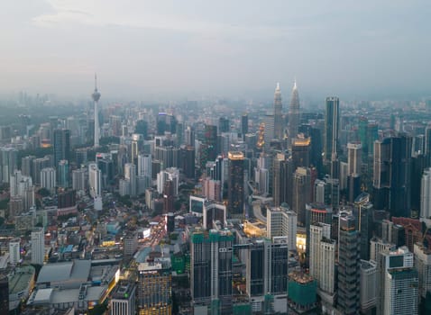 Bukit Bintang, Kuala Lumpur, Malaysia - Nov 28 2022: Aerial view of Kuala Lumpur town at blue hour is a stunning sight to behold, with the city's vibrant lights creating a dazzling display.