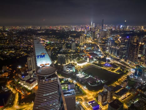 Lembah Pantai, Selangor, Malaysia - Nov 09 2022: Aerial view TM Telekom tower in night with background of high architecture
