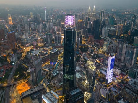 Bukit Bintang, Kuala Lumpur, Malaysia - Nov 28 2022: Exchange 106 tower is beautifully lit up at night in aerial view