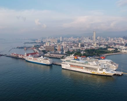 George Town, Penang, Malaysia - Apr 13 2022: Aerial view three cruise ship park at Penang Port
