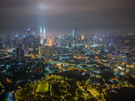 Bukit Bintang, Kuala Lumpur, Malaysia - Nov 28 2022: The city's diverse architecture, from traditional shophouses to modern skyscrapers, is on full display at night