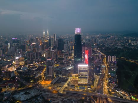Bukit Bintang, Kuala Lumpur, Malaysia - Nov 28 2022: Skyscraper Exchange 106 at KL city in blue hour. Aerial view