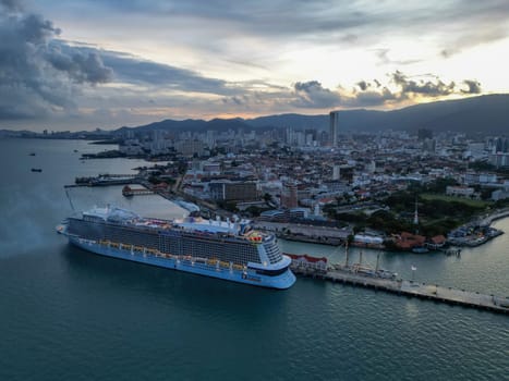 George Town, Penang, Malaysia - Nov 01 2022: Drone shot view Genting Dream cruise ship part at the Penang Port