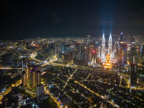 Bukit Bintang, Kuala Lumpur, Malaysia - Nov 29 2022: Aerial view of Kuala Lumpur town at night is a testament to the city's cosmopolitanism and modernity