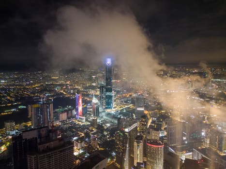 Bukit Bintang, Kuala Lumpur, Malaysia - Nov 12 2022: The Exchange 106 illuminated endlessly towards the sky, creating a mesmerizing effect.