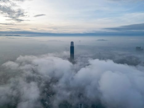Bukit Bintang, Kuala Lumpur, Malaysia - Nov 13 2022: The low clouds provide a misty veil around the Exchange 106, adding to its mystique.
