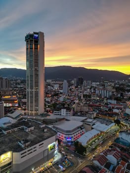 George Town, Penang, Malaysia - Sep 26 2022: Vertical view of Komtar building and Prangin Mall in dramatic sunset hour