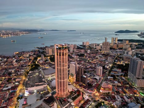 George Town, Penang, Malaysia - Sep 26 2022: Aerial view illuminated Komtar building in blue hour