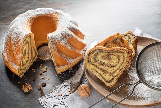 Potica, traditional Slovenian bread cake roll with walnuts. Sweet bread roll stuffed with walnuts and sprinkle with sugar
