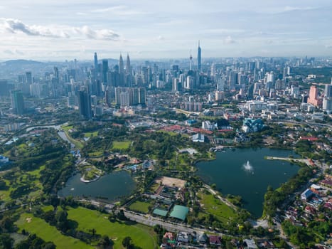Bukit Bintang, Kuala Lumpur, Malaysia - Dec 05 2022: Taman Titiwangsa with background of KL city. Aerial view