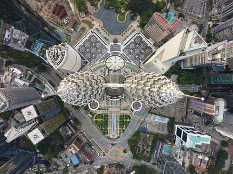 Bukit Bintang, Kuala Lumpur, Malaysia - Dec 25 2022: Aerial top down Kuala Lumpur City Centre Petronas Twin Tower