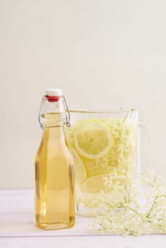 Elderflowers,sugar and lemons in a bottle for the production of elderflower syrup