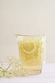 Elderflowers,sugar and lemons in a bottle for the production of elderflower syrup