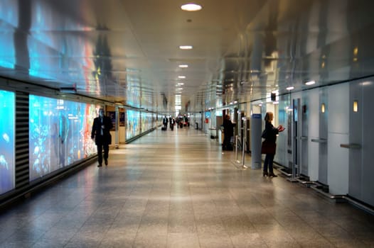 Frankfurt,Germany – November 27,2014: An underpass or a connecting tunnel of individual airport terminals at Frankfurt Airport with travellers on 27 November 2014 in Frankfurt.