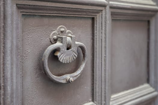 Old metal knocker on a door